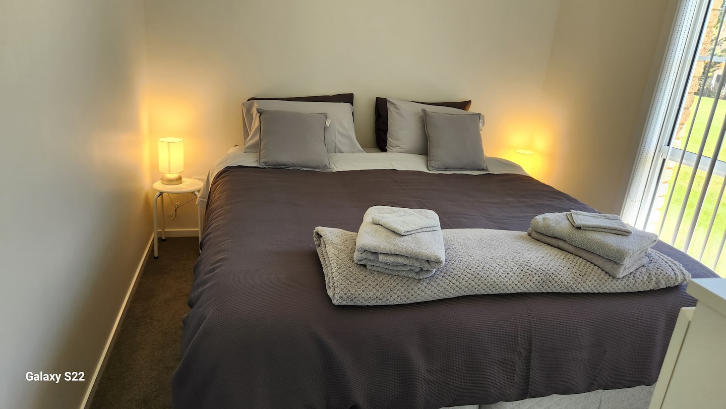 King bed with bedside lighting