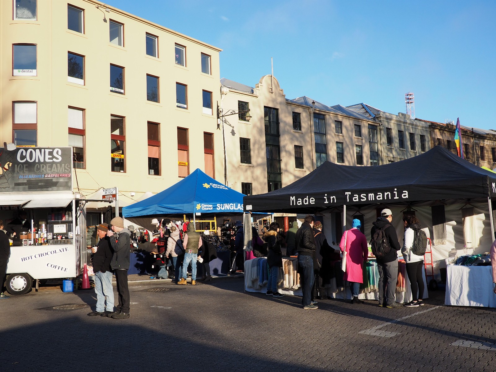 Shoppers and Tasmanian stalls at Salamanca Market in Hobart